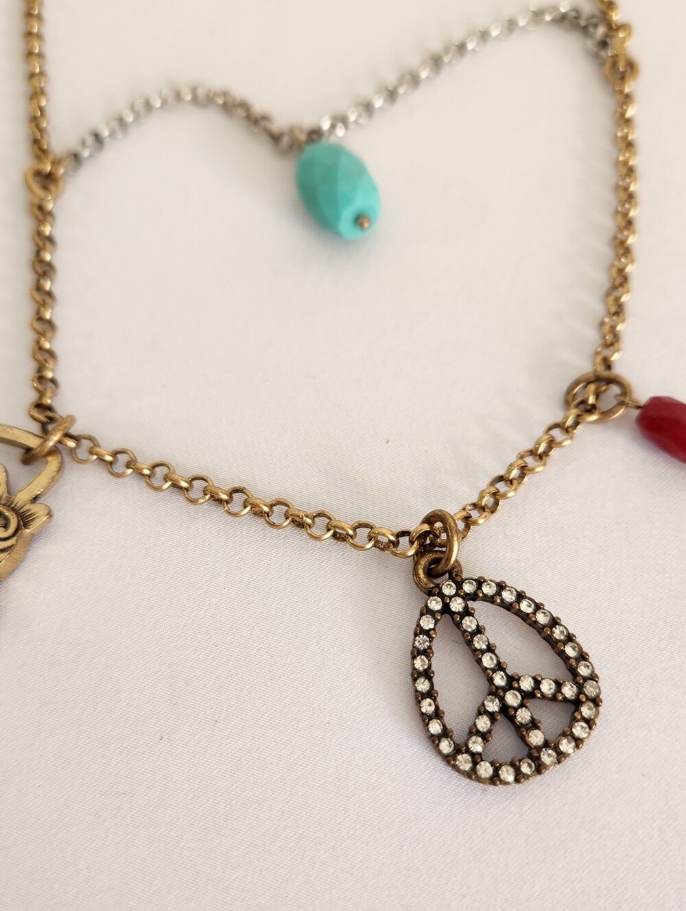 Brass Peace Drop Charm Necklace with Turquoise and Red Accents LUCKY